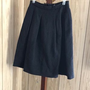 H&M black midi skirt size 8. Embossed texture.